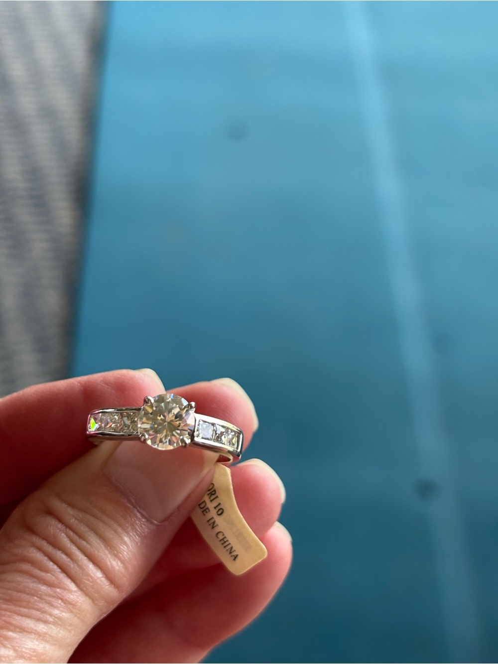 Classic Solitaire-Style Silver Engagement Ring with Clear Center Stone